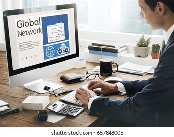 Man working on computer network graphic overlay