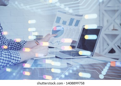 A man working on computer with technology theme drawing. Concept of big data. Multi exposure.