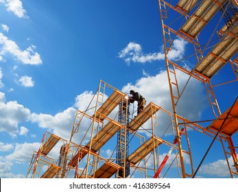 Man Working on the Working at height with blue sky