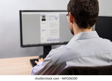 man working on his CV in office - stock photo