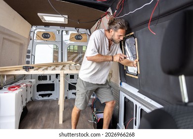 Man Working On The Interior Of His Camper Van