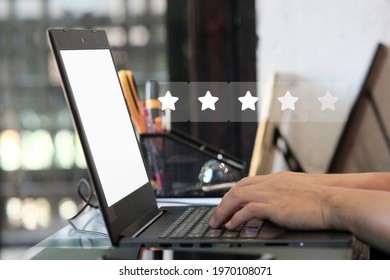 Man Working On Laptop Computer And Positive Feedback, Writing Online Review With 5 Five Star Rating, Reputation Management Concept