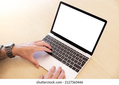 Man working on laptop computer, blank screen mockup