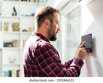 Man working on smart home device - Powered by Shutterstock