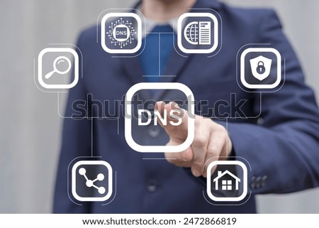 Man working on virtual touch screen presses abbreviation: DNS. DNS Domain Name System Server Network Web Communication concept.