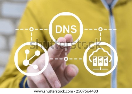 Man working on virtual touch screen presses abbreviation: DNS. DNS Domain Name System Server Network Web Communication Technology concept.