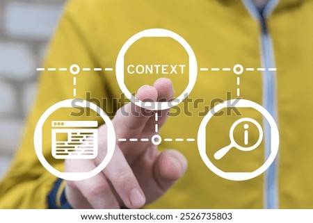 Man working on virtual touch screen presses word: CONTEXT. Context business concept. Context analytic and learning.