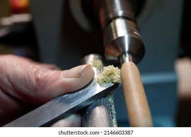 Man Working On A Wood Lathe. 