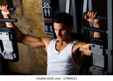 Man Working Out In Gym On Pec Flye