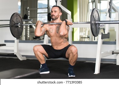 Man Working Out Legs With Barbell In A Gym - Front Squat Exercise