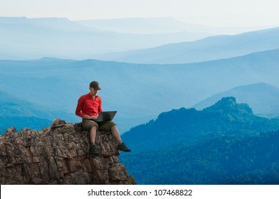 Man Working Outdoors With Laptop