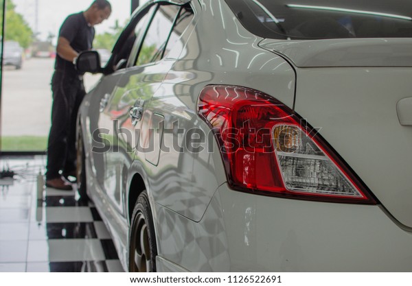 Man working for
polishing, coating cars.