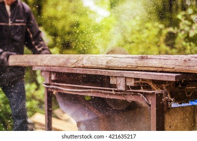 Man Working At Saw Mill