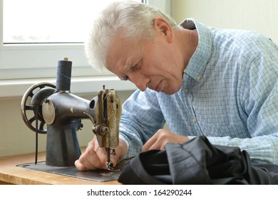 Man Working At Sewing Machine