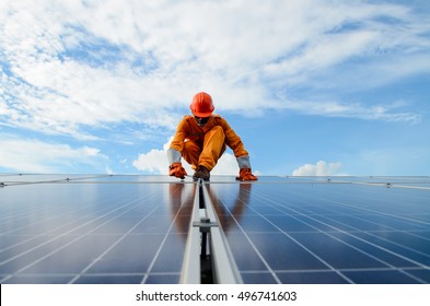 A Man Working At Solar Power Station