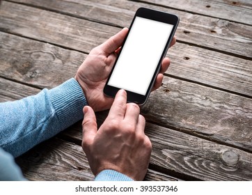 Man working with touchscreen of a smart phone. Clipping path included. - Powered by Shutterstock