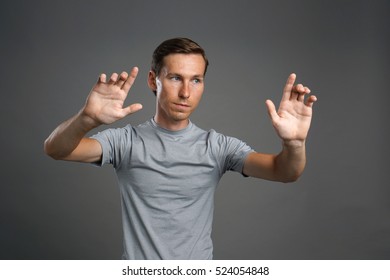Man working with transparent virtual interface screen.