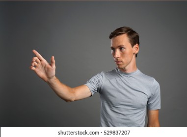 Man working with transparent virtual interface screen.