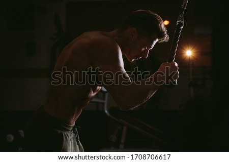 man workout twisting exercises for abs. Bodybuilder abdominal workout in gym. Effective abs twisting excercises