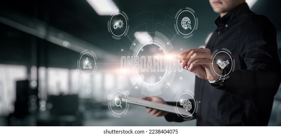 A man works with adaptation on a virtual screen on the background of an industrial room. - Shutterstock ID 2238404075