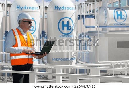 Man works for energy company. Engineer stands among hydrogen equipment. Mechanic with laptop controls process of obtaining energy. Man inspects hydrogen power plant.  electricity from hydrogen H2