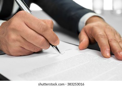 Man Works With Papers. The Document Needs A Signature. Signing A Letter. Official Letter To A Partner.