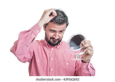 Man Worried About Gray Hair Looking In A Mirror