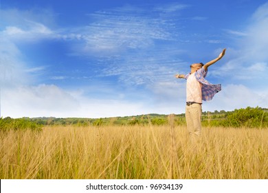 Man worshiping god shot at yellow grass