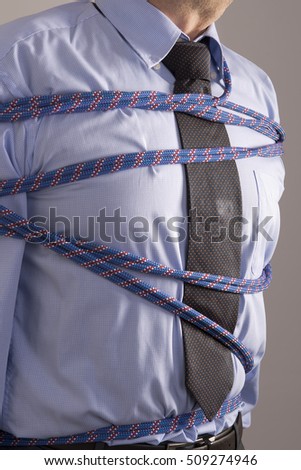 man wrapped with a rope at the bust