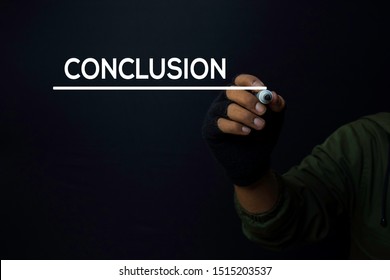 A Man Write A Conclusion With A Black Background