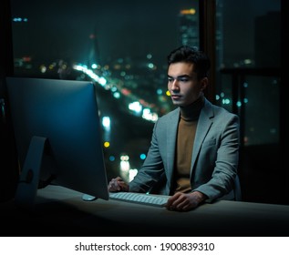 Man Write Emails at Work With Beautiful Night View - Shutterstock ID 1900839310