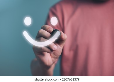 Man writing Happy smiley face,Customer service Satisfaction, good feedback rating,positive customer review,experience, satisfaction survey,mental health assessment,wellness,world mental health concept