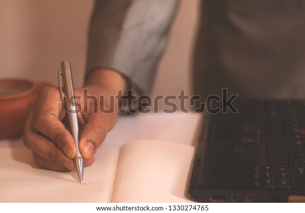 Man Writing Note His Office Desk Stock Photo Edit Now 1330274765