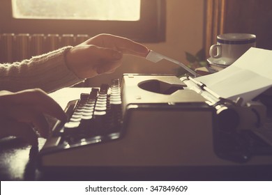 Man Writing On Old Typewriter.