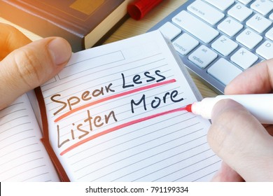 Man writing quote Speak less listen more.