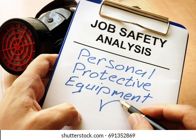 Man Is Writing Words Personal Protective Equipment (PPE).