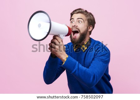 Man yelling into a megaphone 


