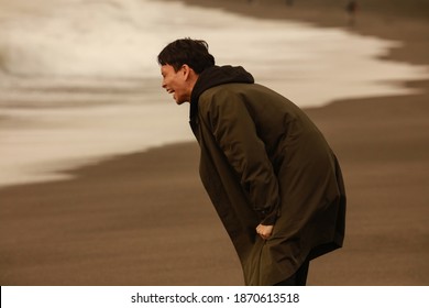 A man yelling at the sea - Powered by Shutterstock