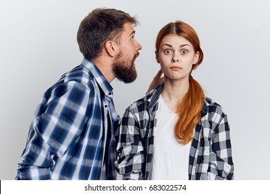 Man Yelling At A Woman On A Light Background                               