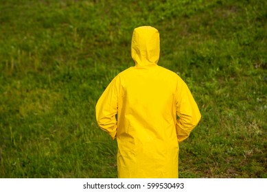 Man In Yellow Raincoat Back