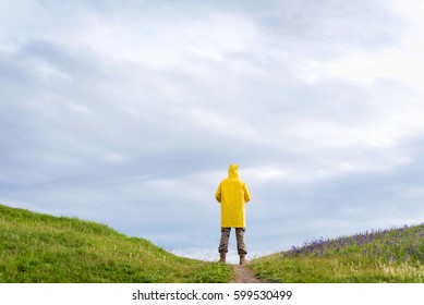 Man In Yellow Raincoat Back