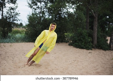 Man In Yellow Raincoat Blown Away By The Wind Falls