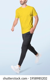 Man In Yellow T-shirt And Black Pants Sportswear Fashion