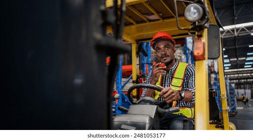 A man in a yellow vest is driving a forklift. Logistics and export industry concept. - Powered by Shutterstock