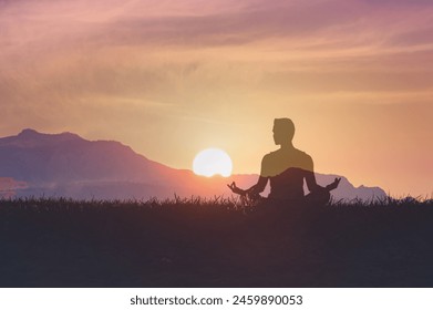 Man in yoga pose, zen meditation at sunset.
 - Powered by Shutterstock