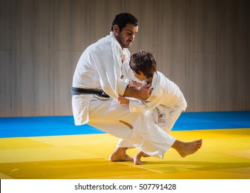 Man And Young Boy Are Training Judo Throwing