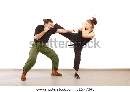 Man and young woman fighting together