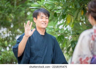 A Man In A Yukata Waving