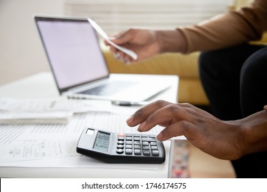 Manage Planning Family Budget, Savings And Payment Concept. Close Up Image Hands Of African Man Using Calculator Calculates Finances Checking Family Expenses, Do Small Business, Month Result Analysis