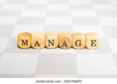 Manage word on wood block - Shutterstock ID 2242786833